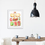 BLT sandwich recipe fine art print in watercolor featuring the ingredients and the finished sandwich, along with step by step illustrations and handwritten instructions in English. The framed poster hanging in a dining space.