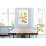 Denver omelet recipe fine art print in watercolor featuring the ingredients and the finished dish, along with handwritten instructions in English. The framed poster hanging in a dining space.