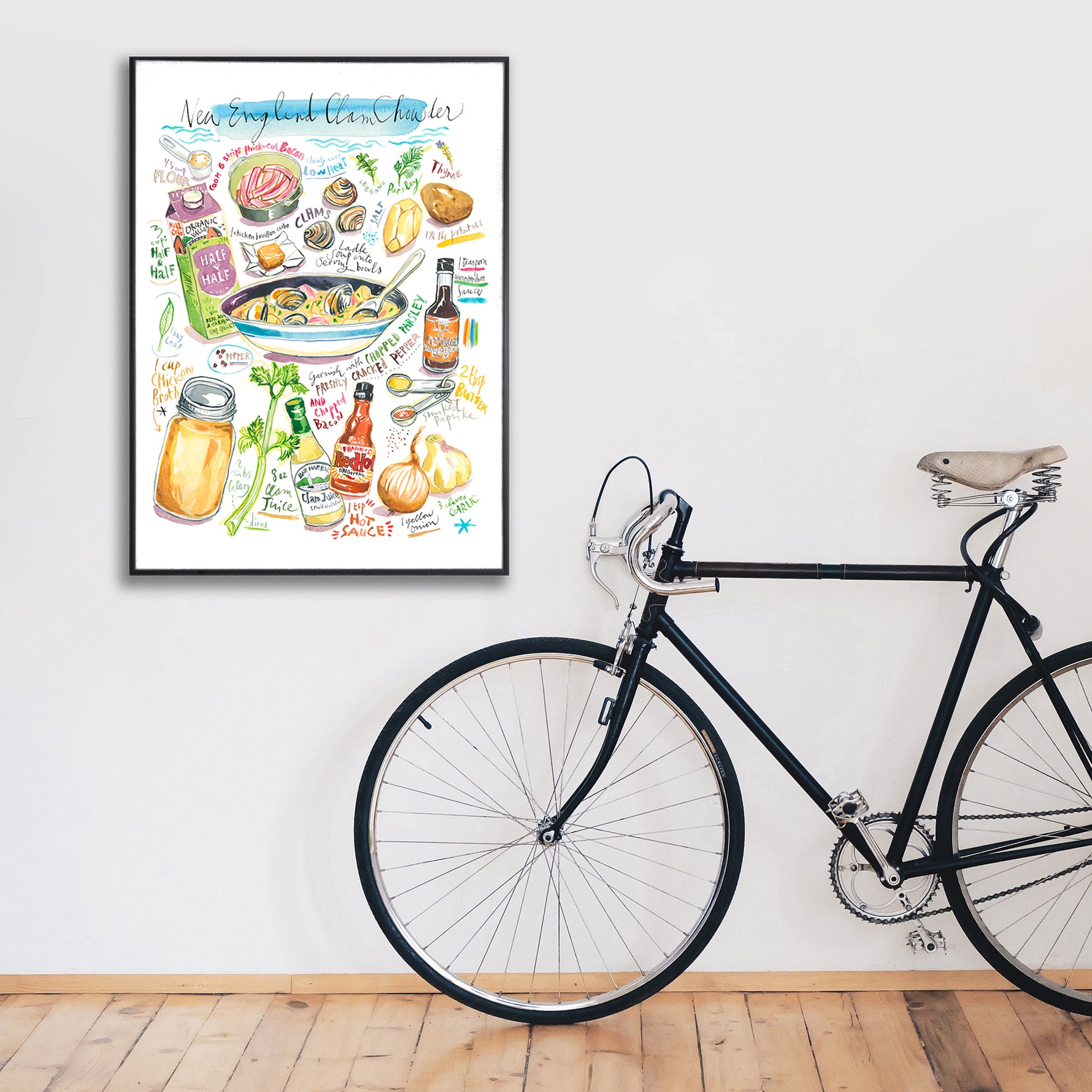 New England clam chowder recipe fine art print in watercolor featuring the ingredients and the finished dish, along with handwritten instructions in English. The framed poster hanging in a home space.