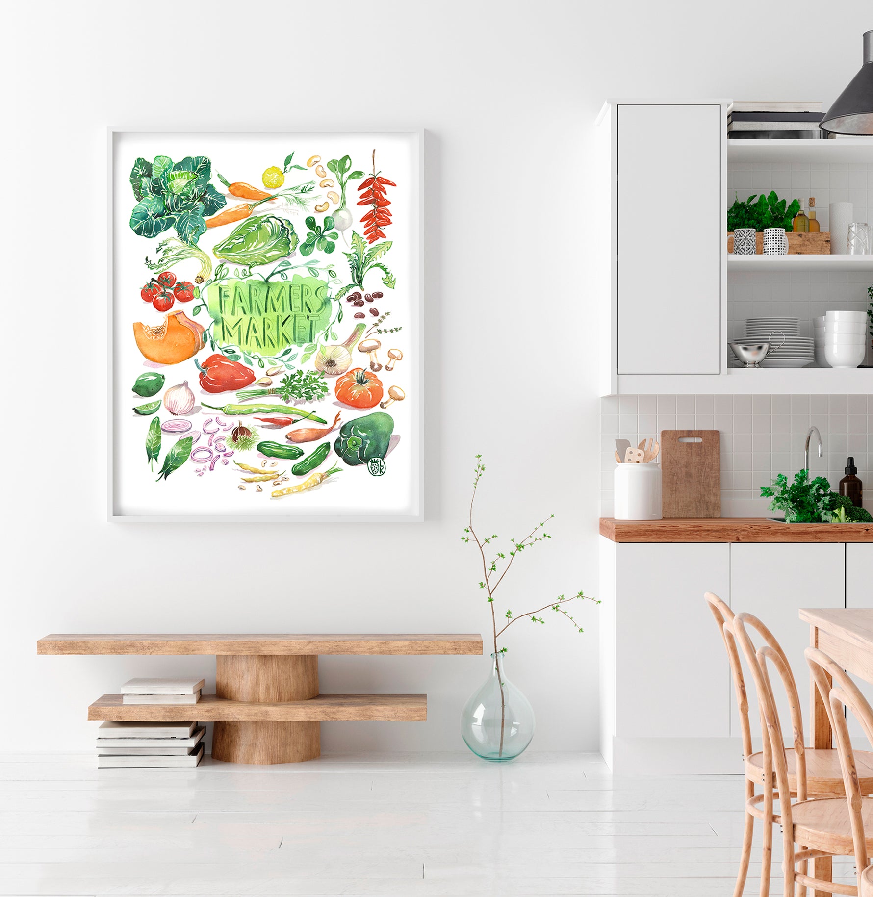 hand painted watercolor print featuring many fresh vegetables and " Framers Market " is hand written in the center of the painting. The print is framed in a dining space