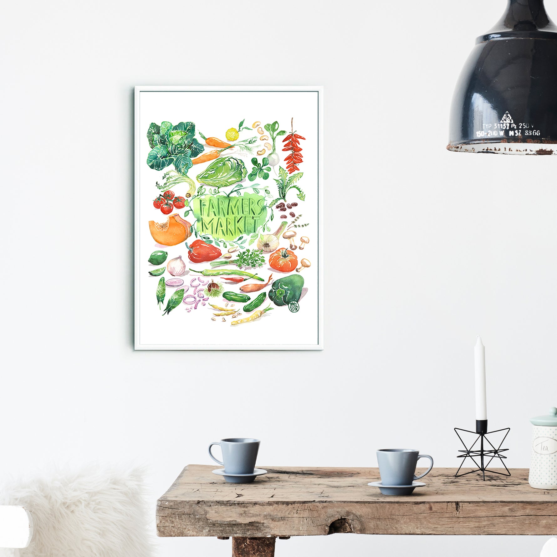 hand painted watercolor print featuring many fresh vegetables and " Framers Market " is hand written in the center of the painting. The print is framed in a dining space