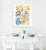 potato latkes recipe fine art print in watercolor featuring the ingredients and the finished dish, along with handwritten instructions in English. The framed poster hanging in a dining space.