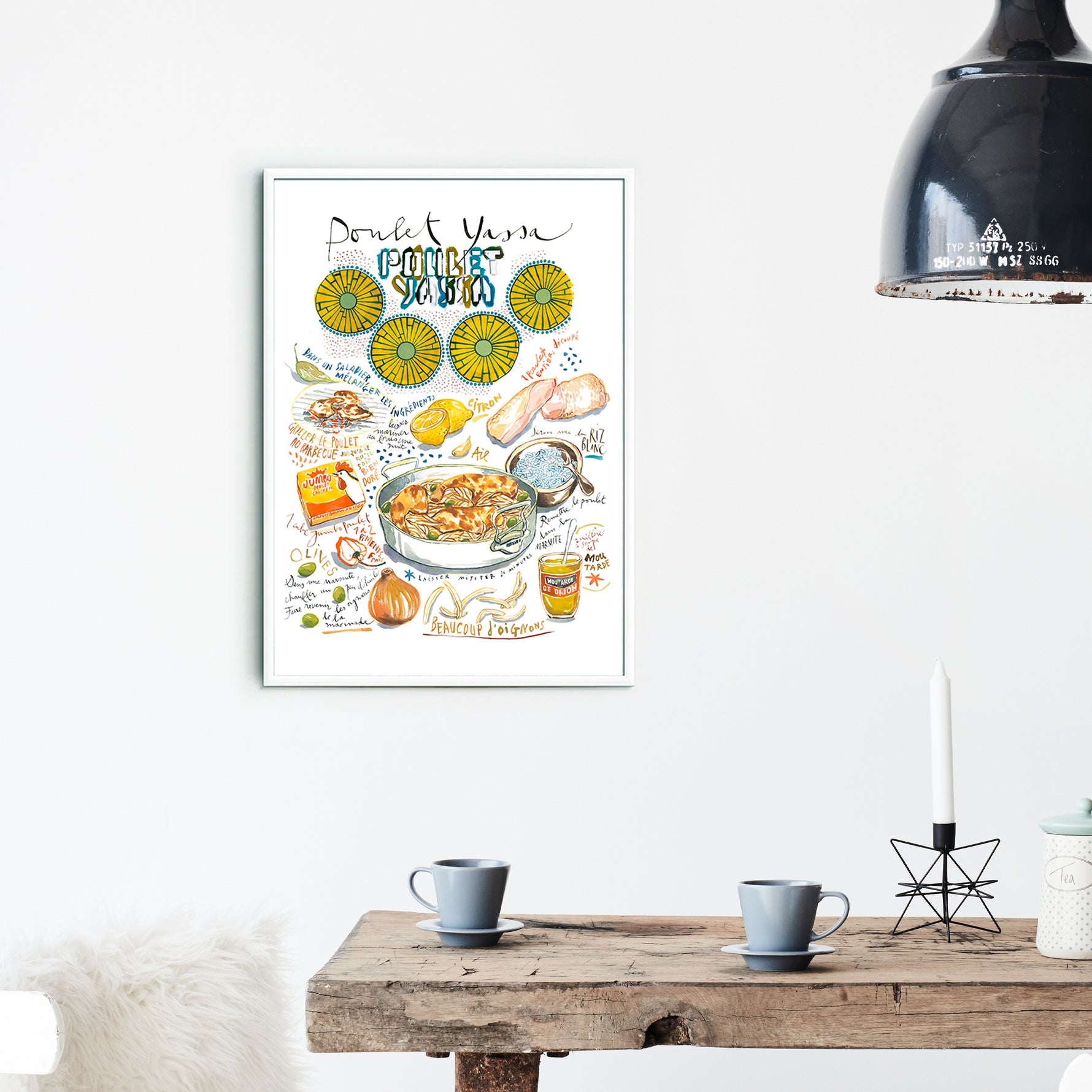 Senegalese yassa chicken recipe fine art print in watercolor featuring the ingredients and the finished dish, along with handwritten instructions in French. The framed poster hanging in a dining space.