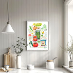 Spanish and Puerto Rican sofrito recipe fine art print in watercolor featuring the ingredients and the finished dish, along with handwritten instructions in English. The framed poster hanging in a dining space.